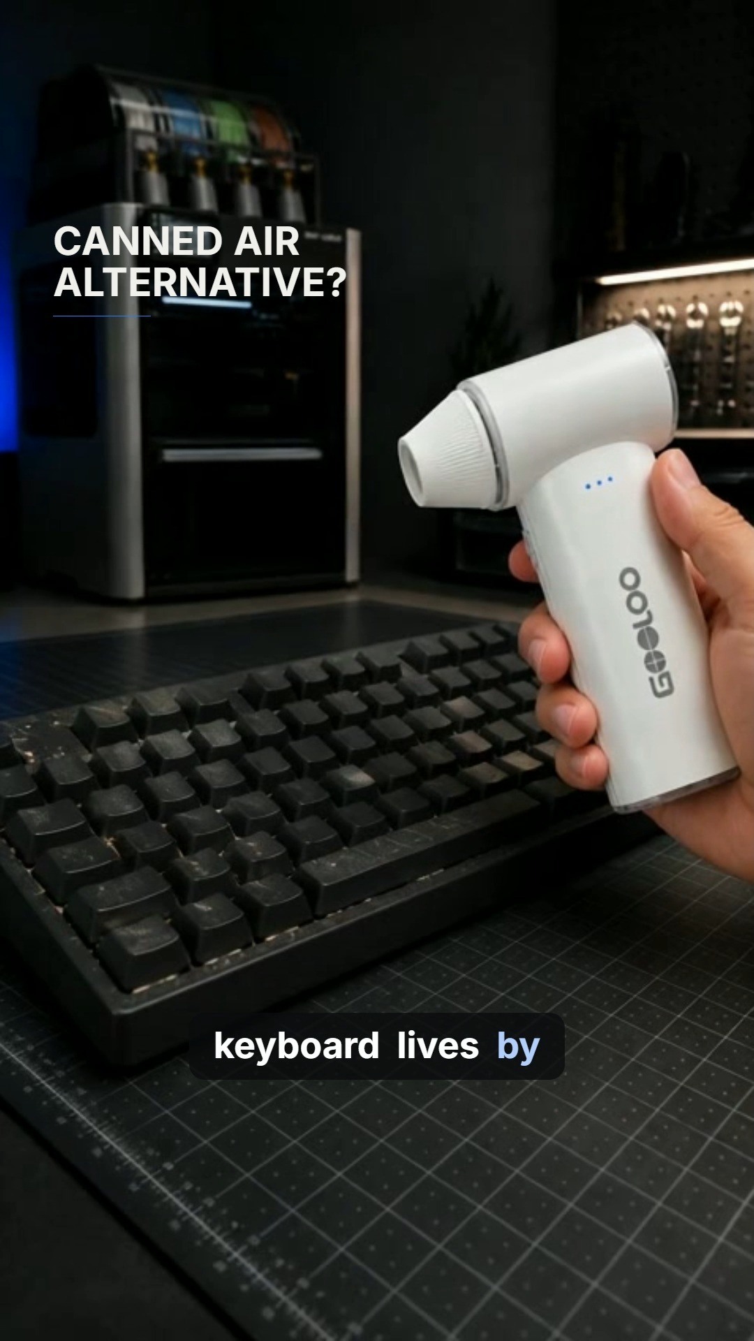GOOLOO F3 air duster demonstrated over a desk